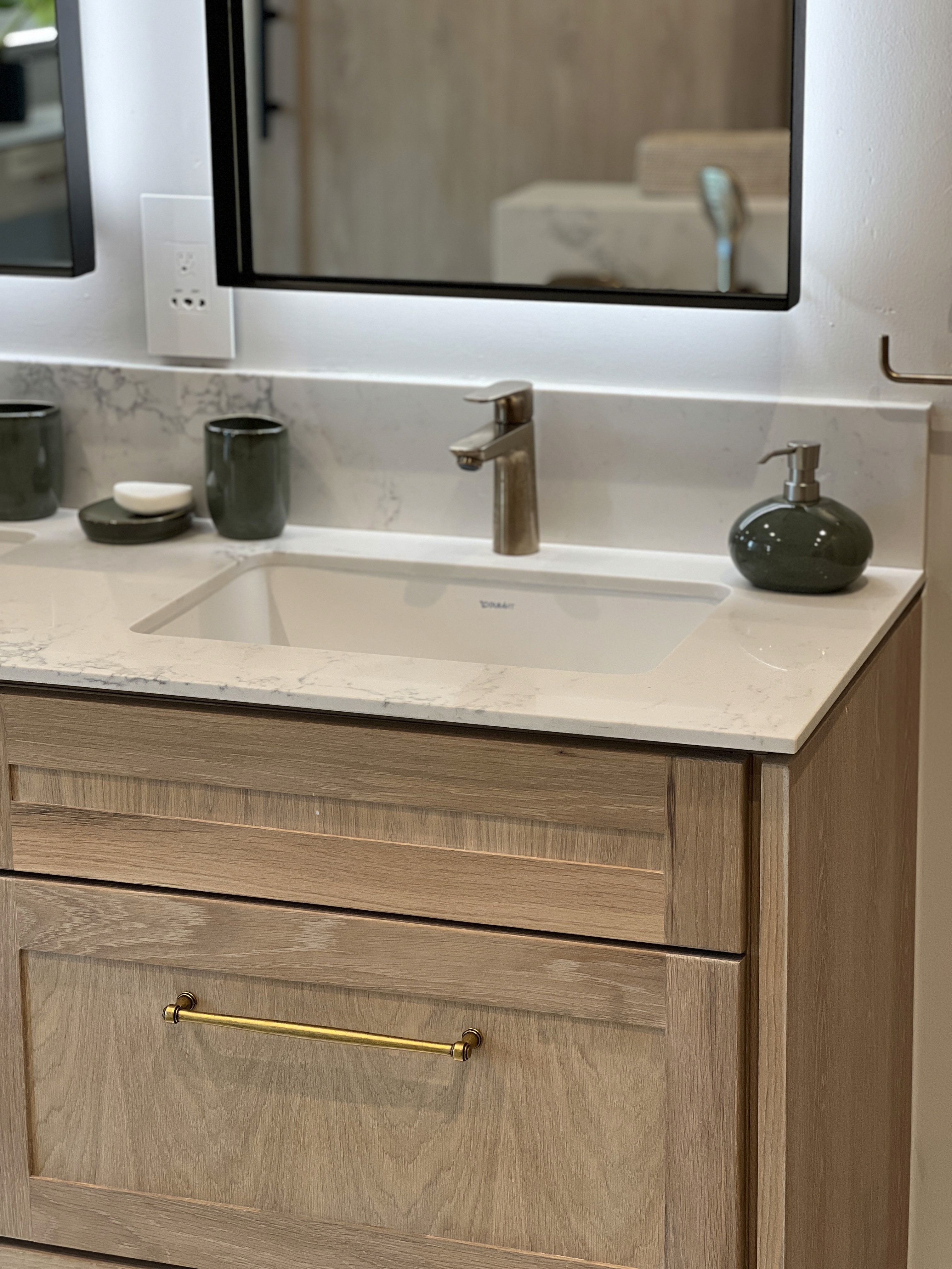Minimalist living space featuring oak flooring, timber wall panels and panoramic windows with natural light.