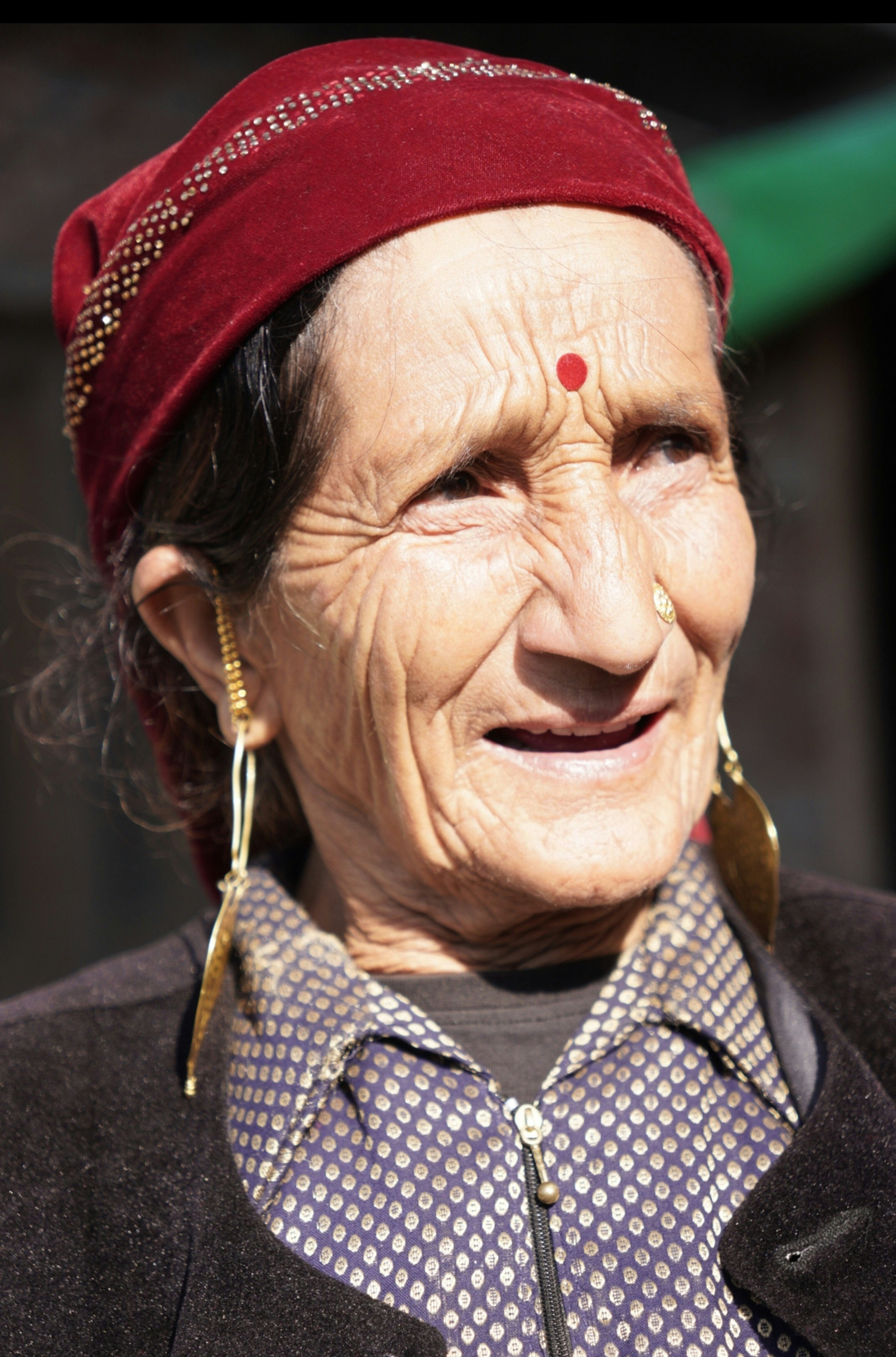A woman wearing a red hat and a black jacket
