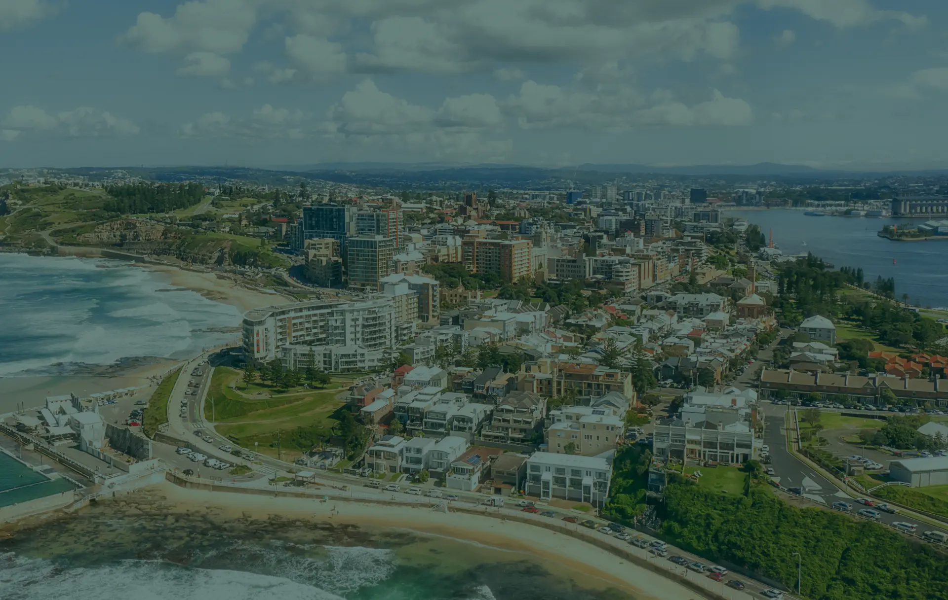 Coastal city with beach and harbor view