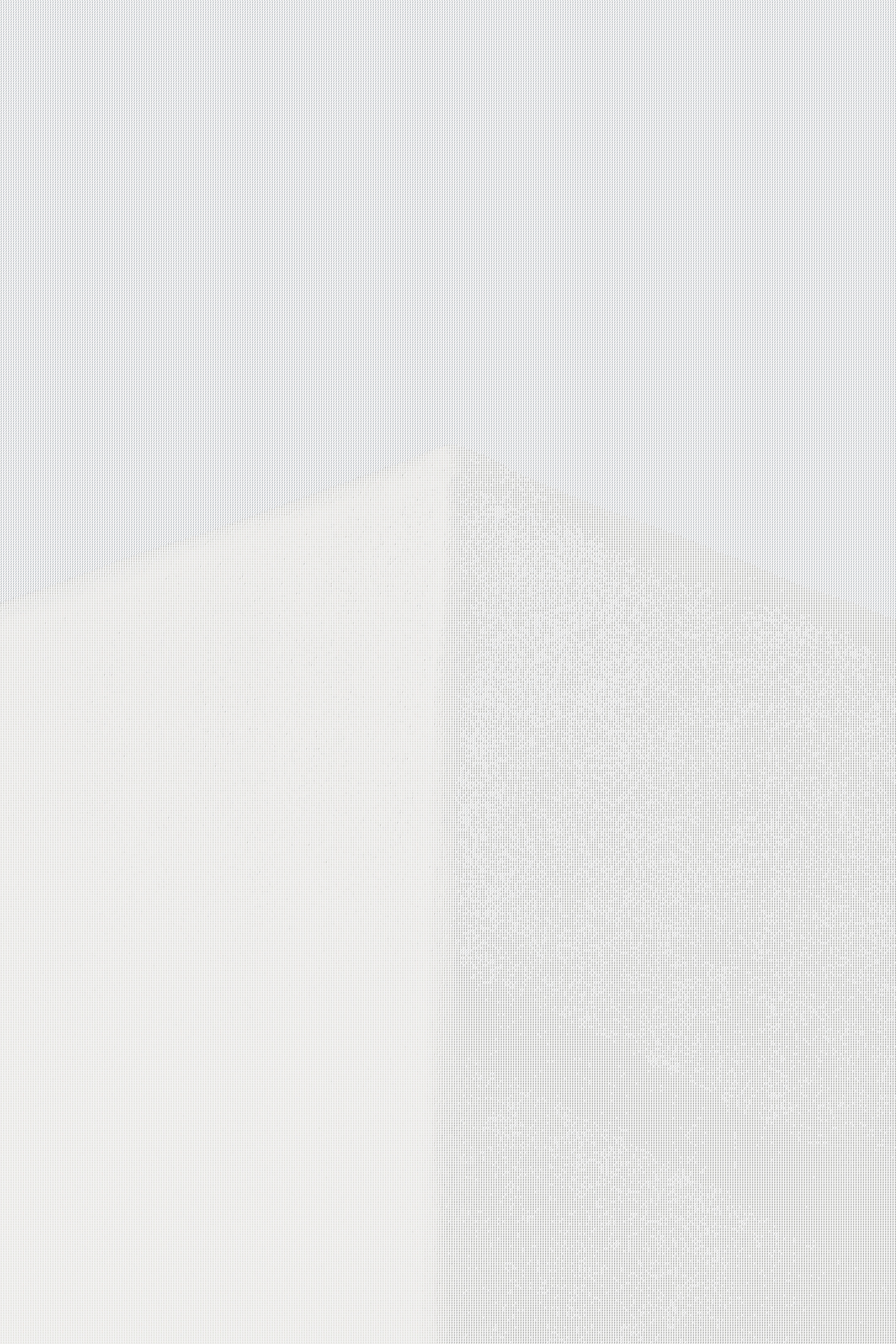 A tall white building with a sky background