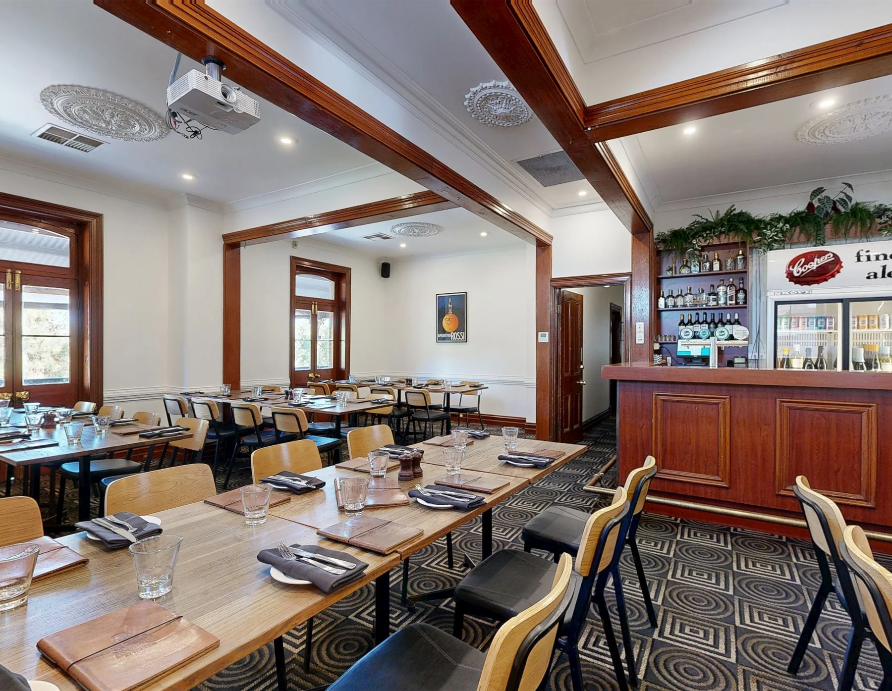 The Maxwell Cooper function room at The Original Coopers Alehouse, captured by ABM visual, showing heritage ceilings, set dining tables and the Coopers bar.