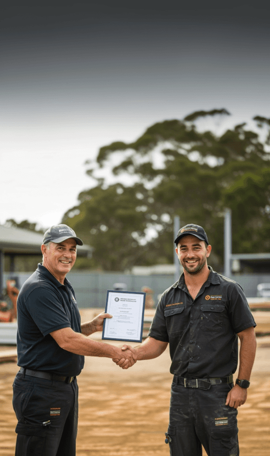 Tradesman recieving qualification from assessor