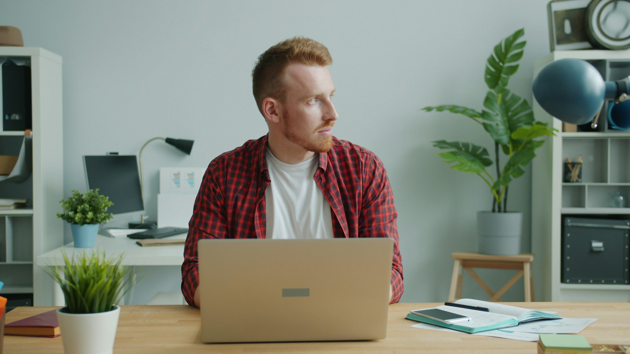 Young male agency founder working in a clean office