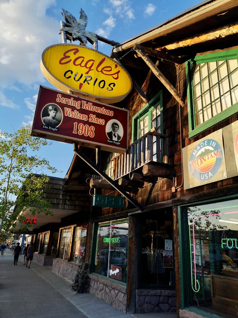 lounge room with large contemporary lamp, cozy sofa and blue toned painting of Venice