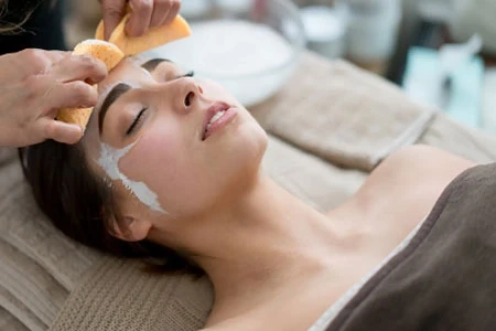 a woman holding a hair dryer in her hand