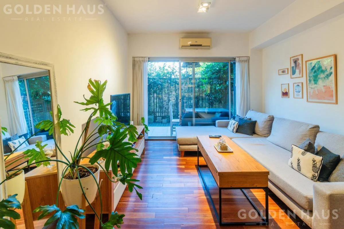 white sofa chair near fireplace