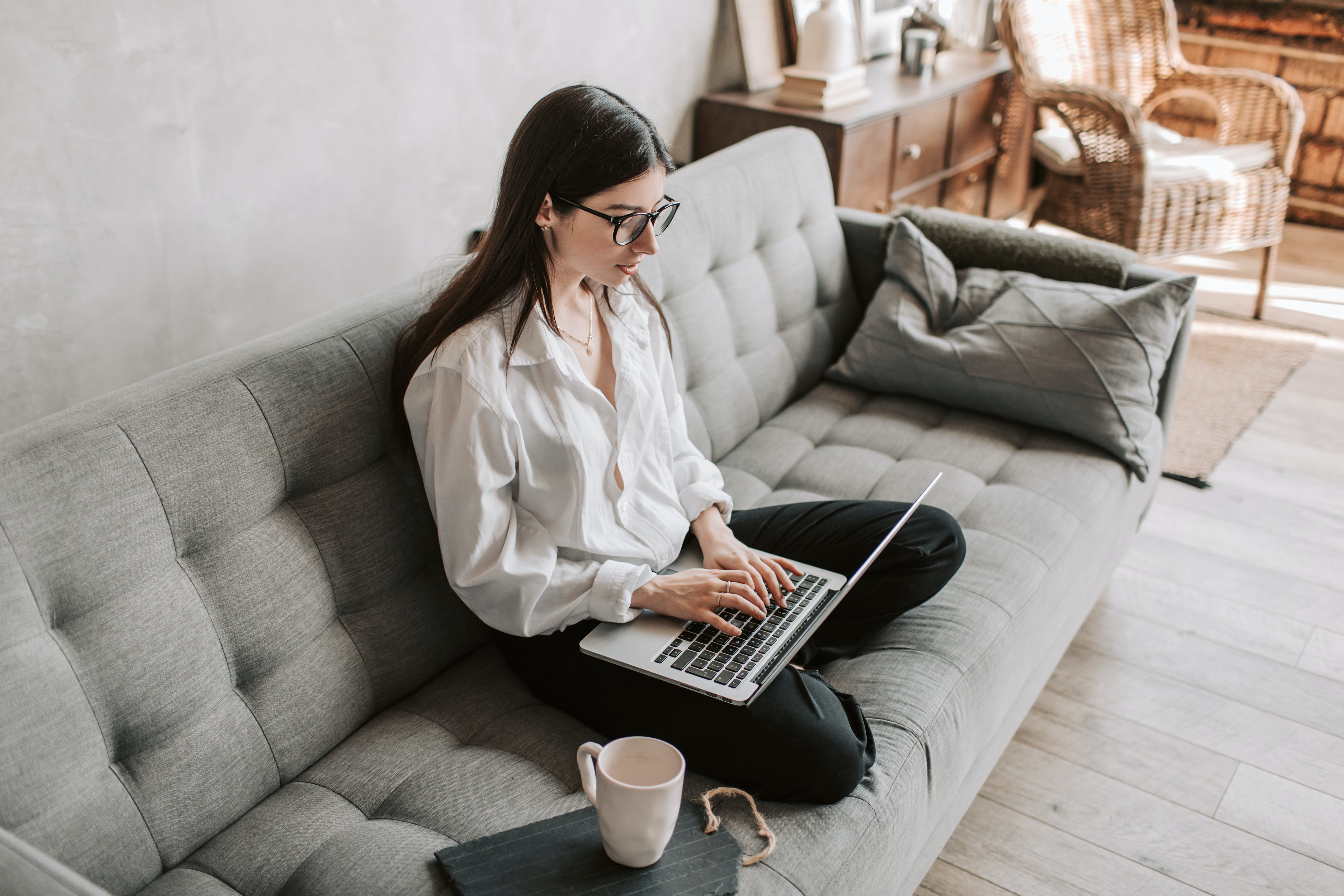 Woman working at home sending cold emails in the best sending hour