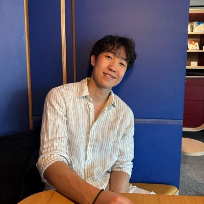 a man standing with black dress