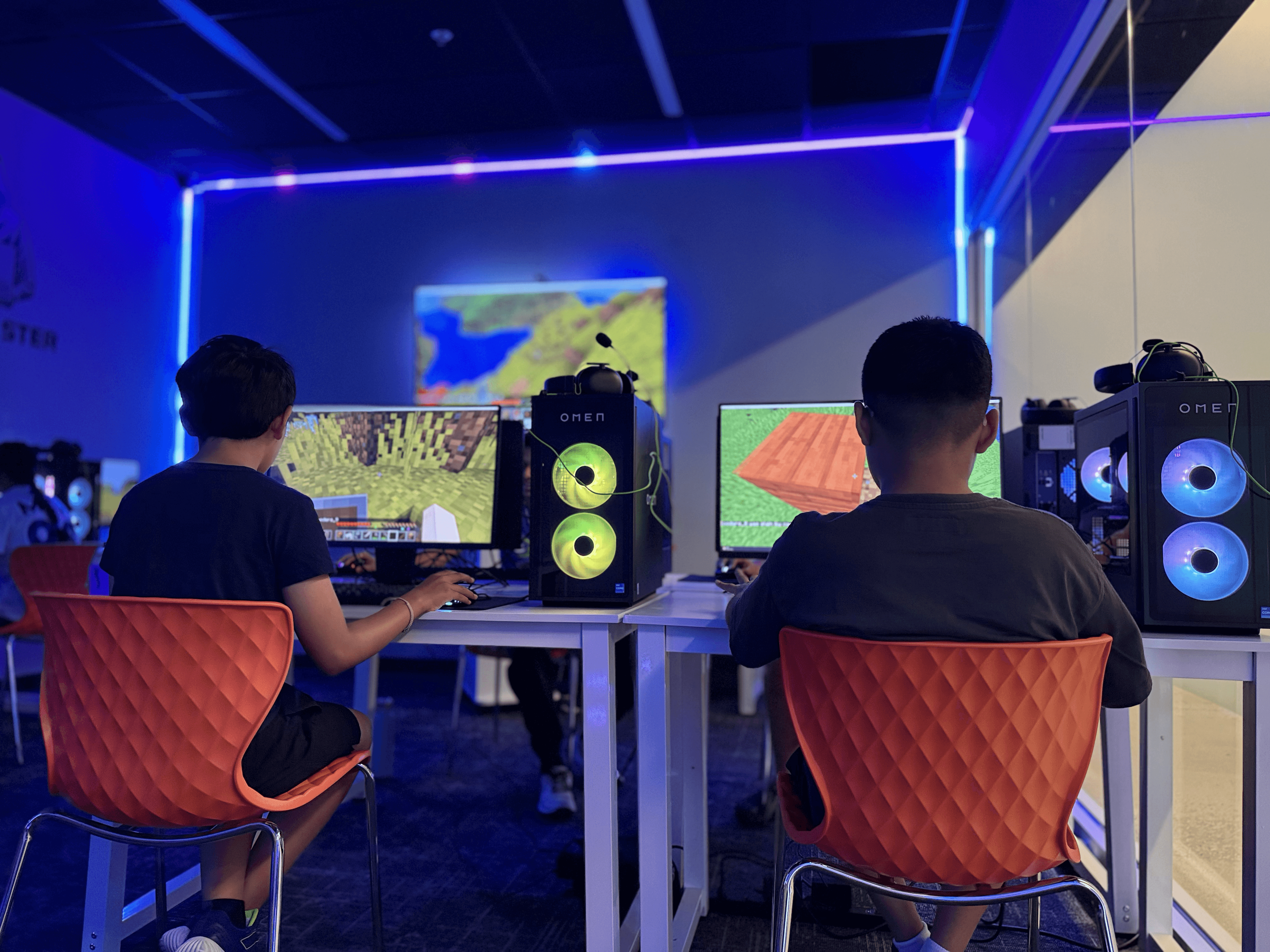 Kids playing Minecraft in a gaming room