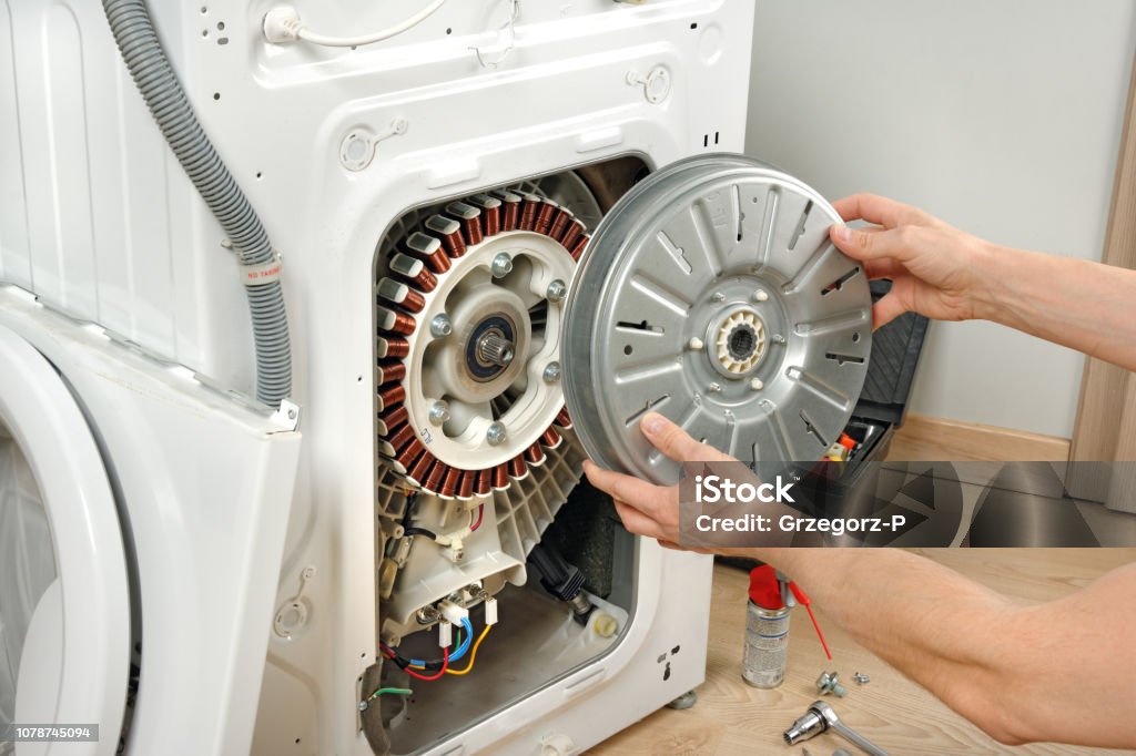 Professional drilling a door handle.