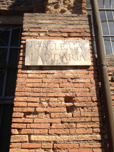 typography plate on brick wall
