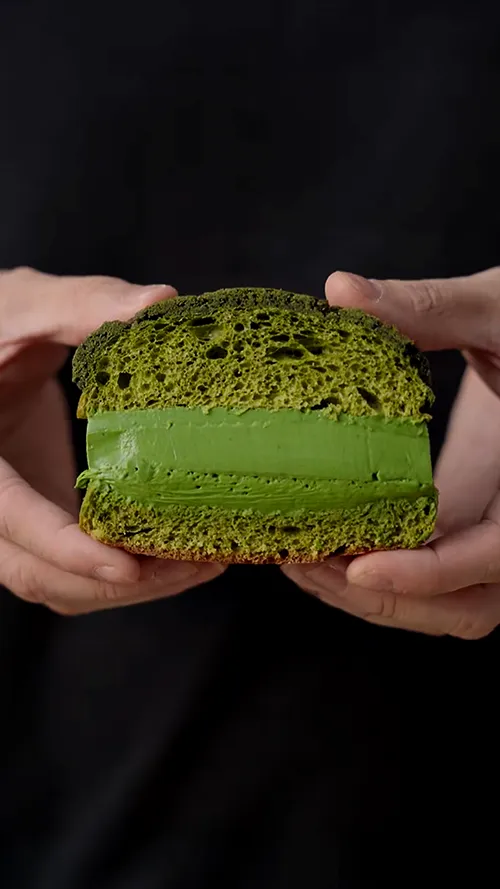 a green smoothie and a smoothie drink on a table