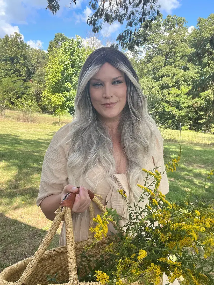 Amber Robinson Registered Herbalist in green field