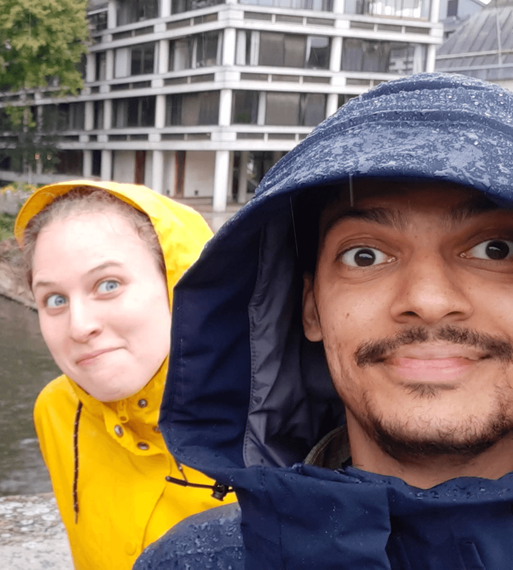 Couple portrait with dog on field