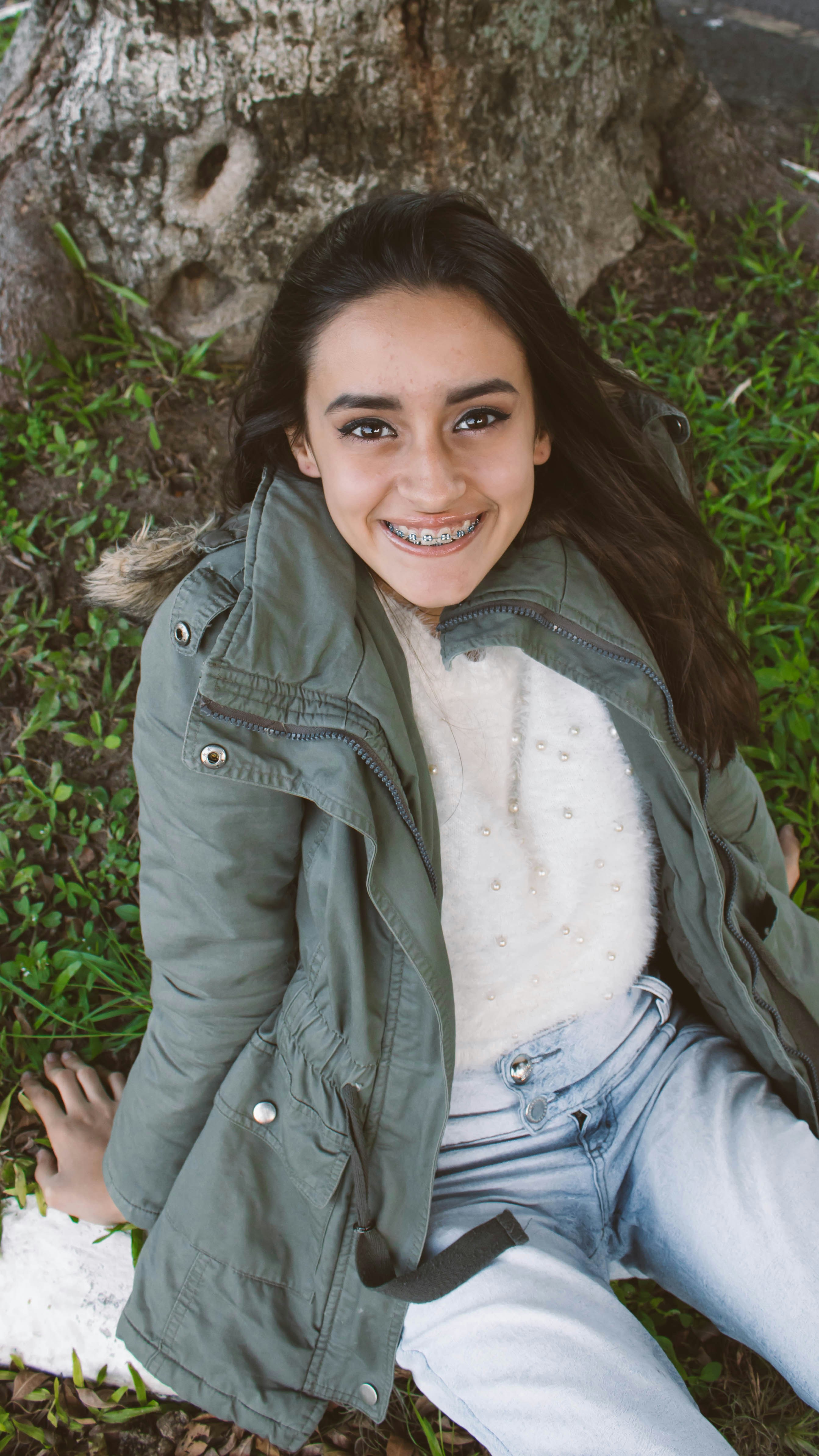 woman wearing green zip-up jacket