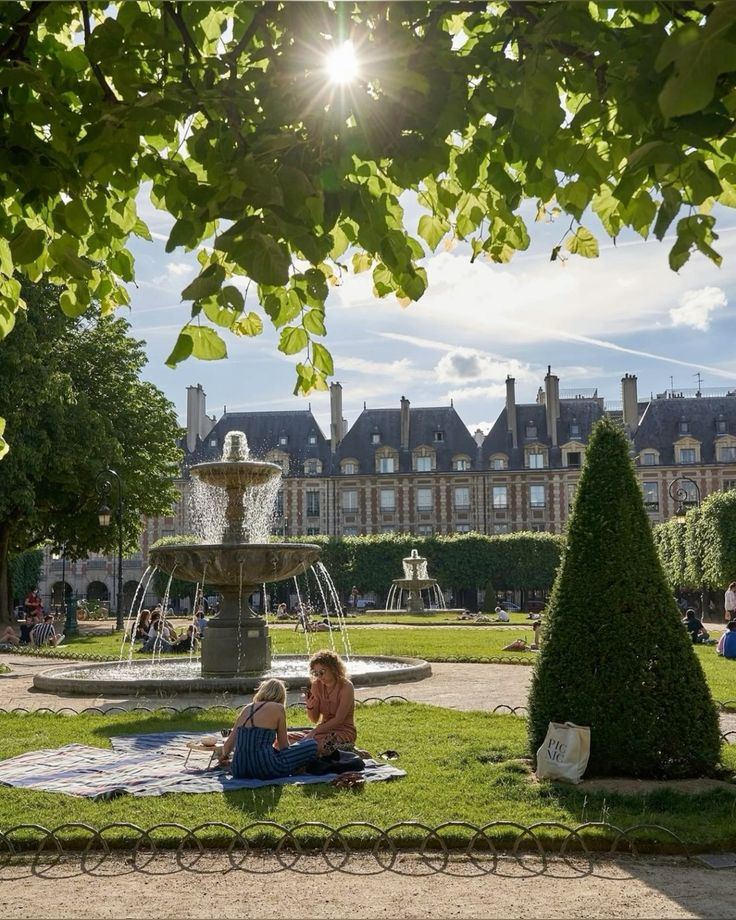 man standing near cliff looking at body of water during daytime