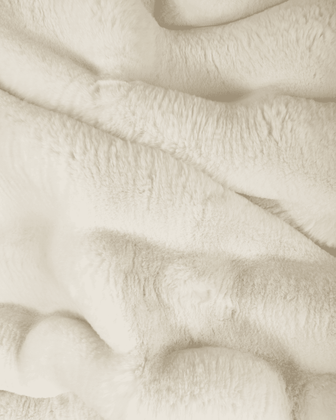 close up fabric shot of a dimensional faux fur blanket in moon