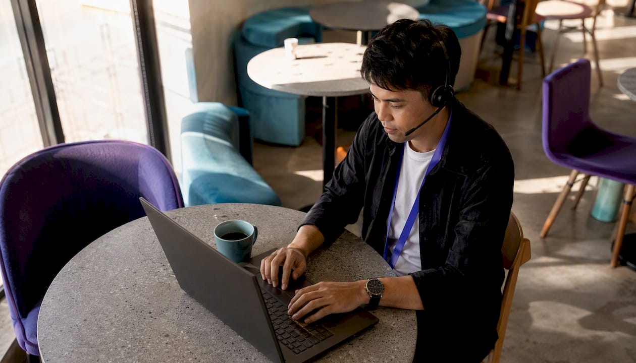 Customer service professional using AI lead routing at home