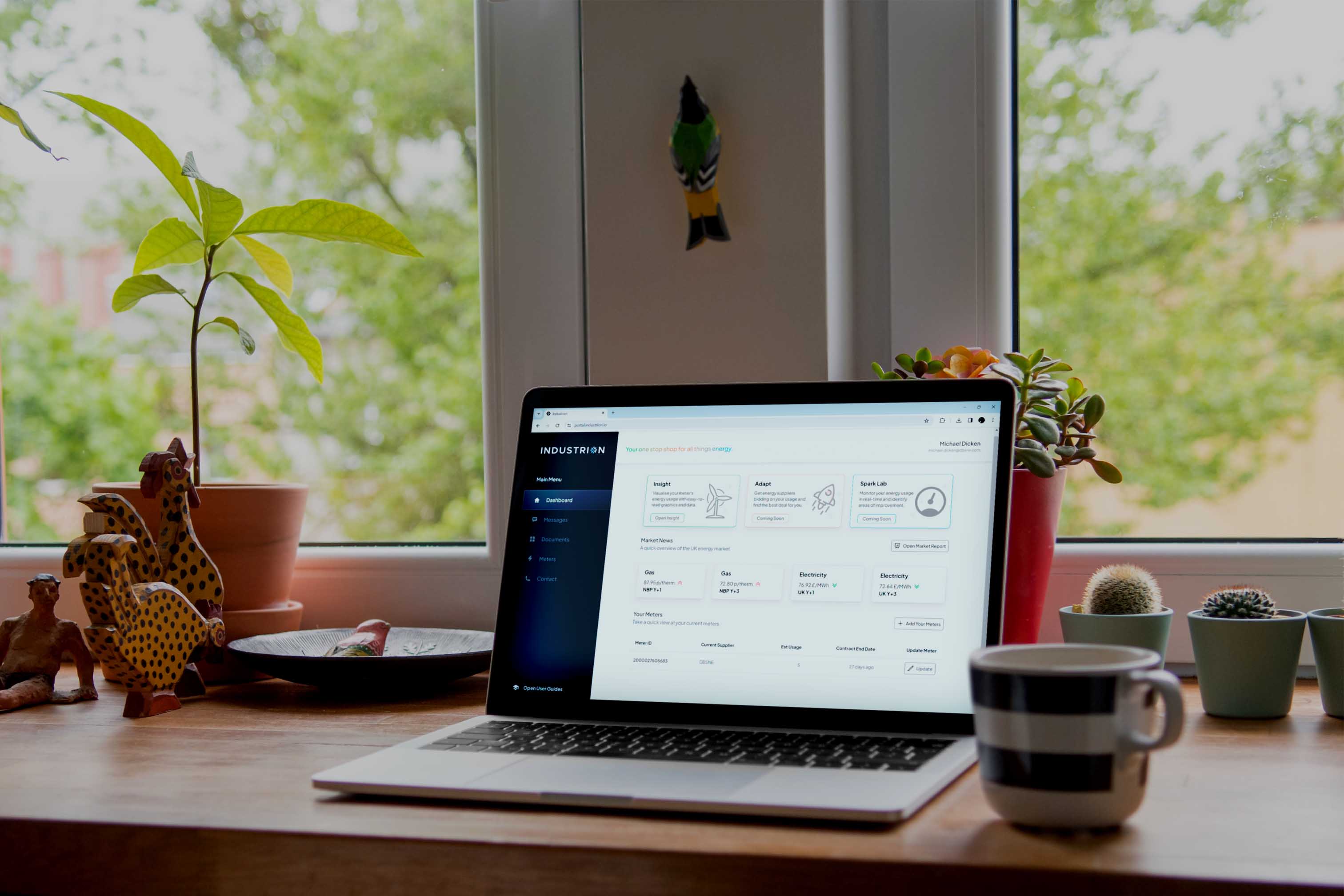 A laptop on a desk showing an energy visualisation tool.