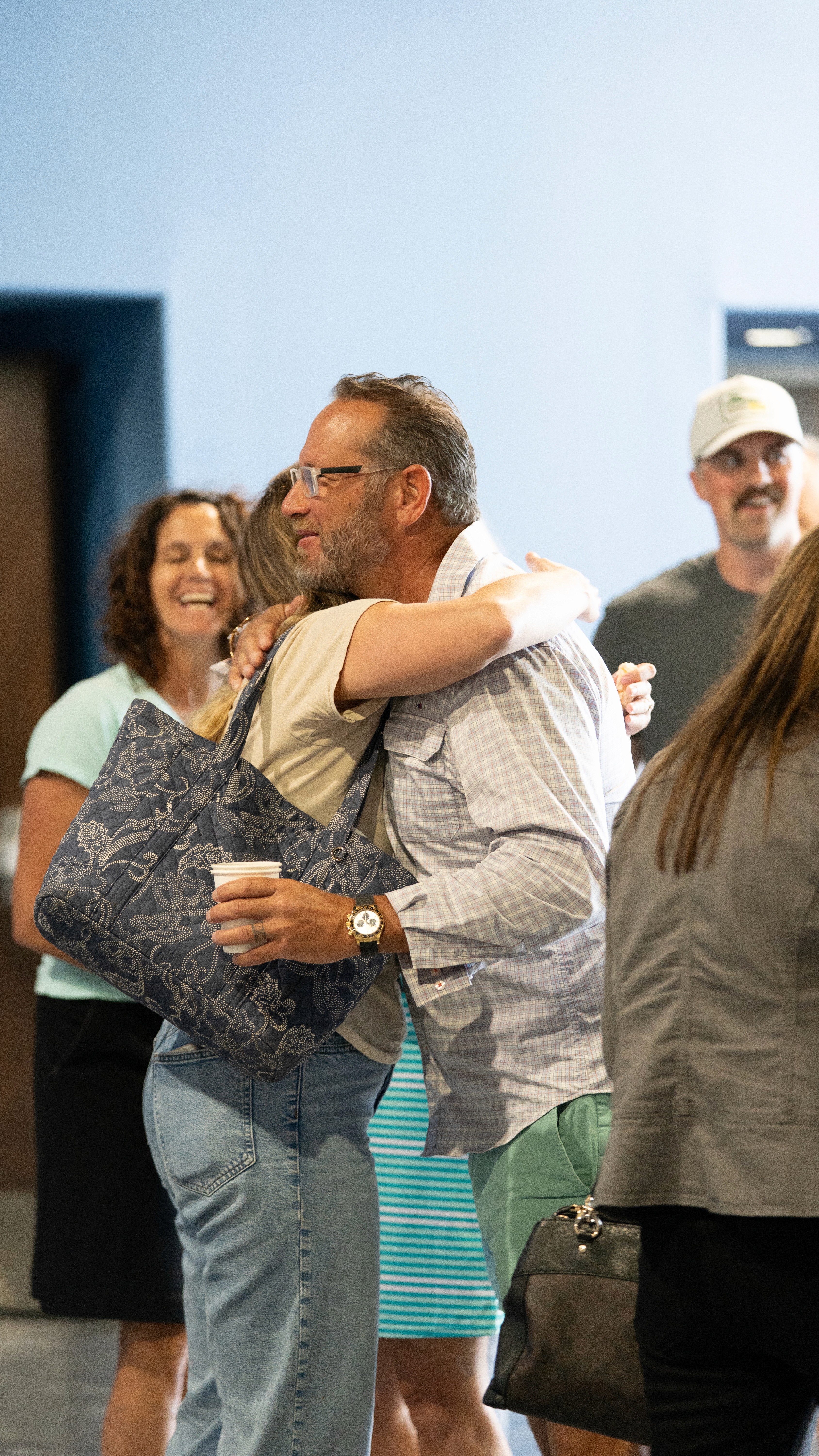 Collage of images with the word "REACH" repeated, showcasing diverse groups of people and activities.