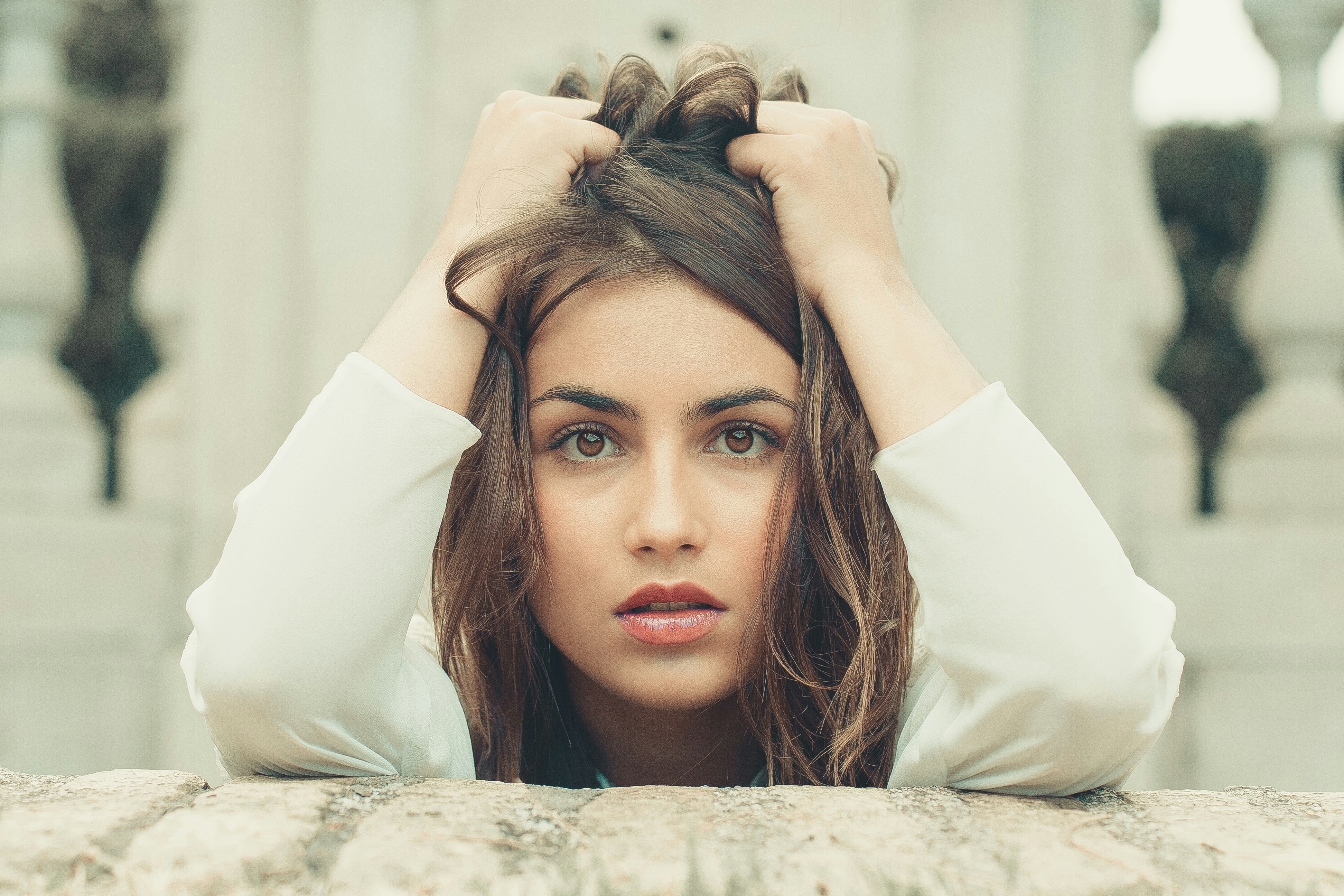 woman holding her hair -Things To Make You Prettier 