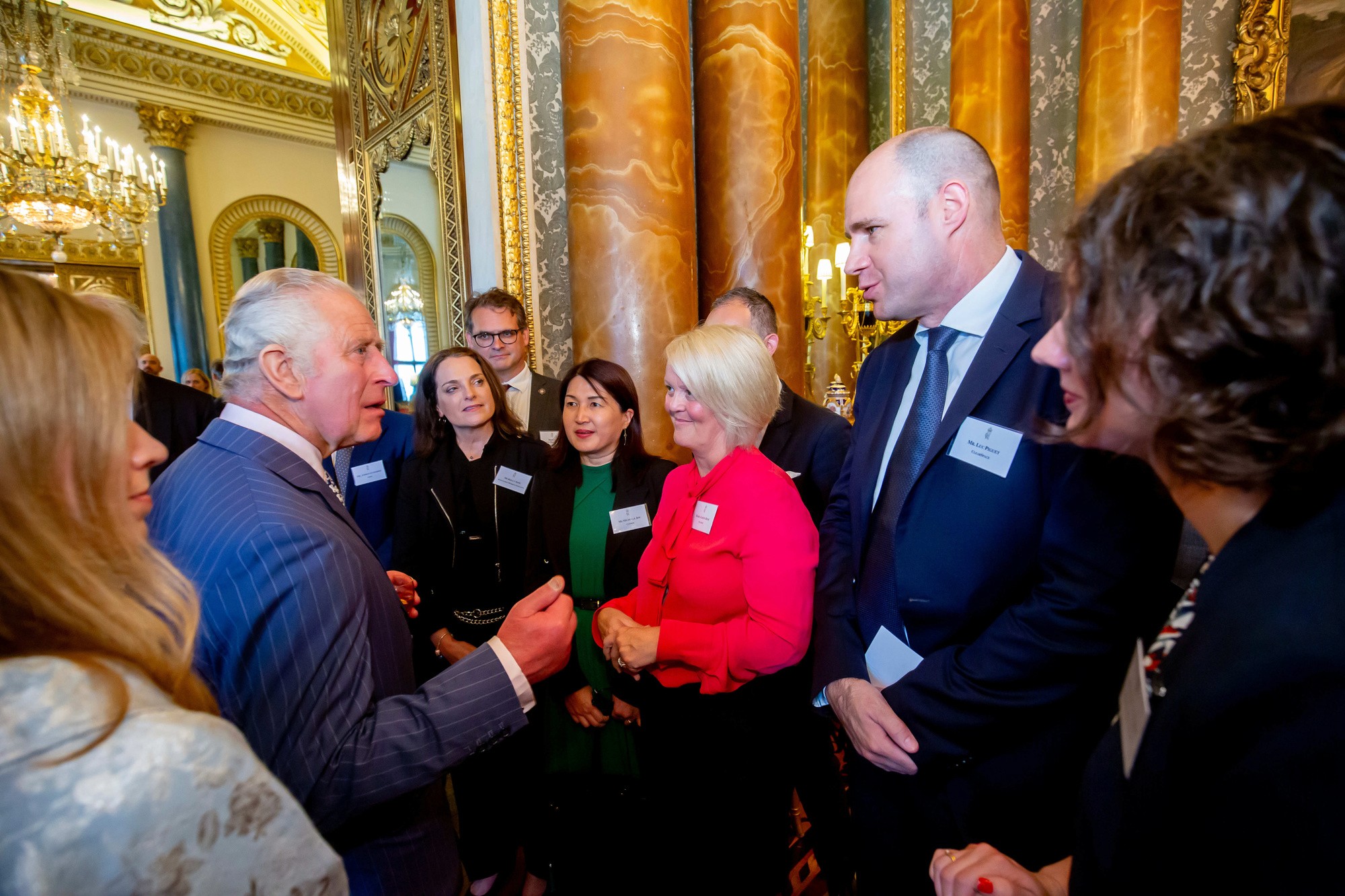 People talking at a formal space event.
