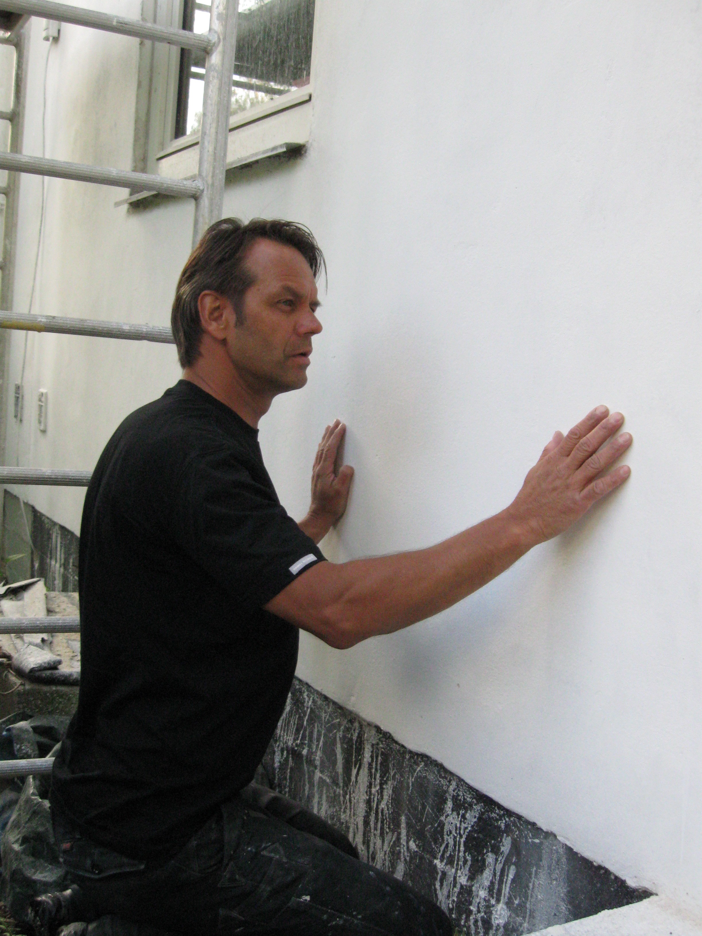 a group of children sitting on steps in front of a building