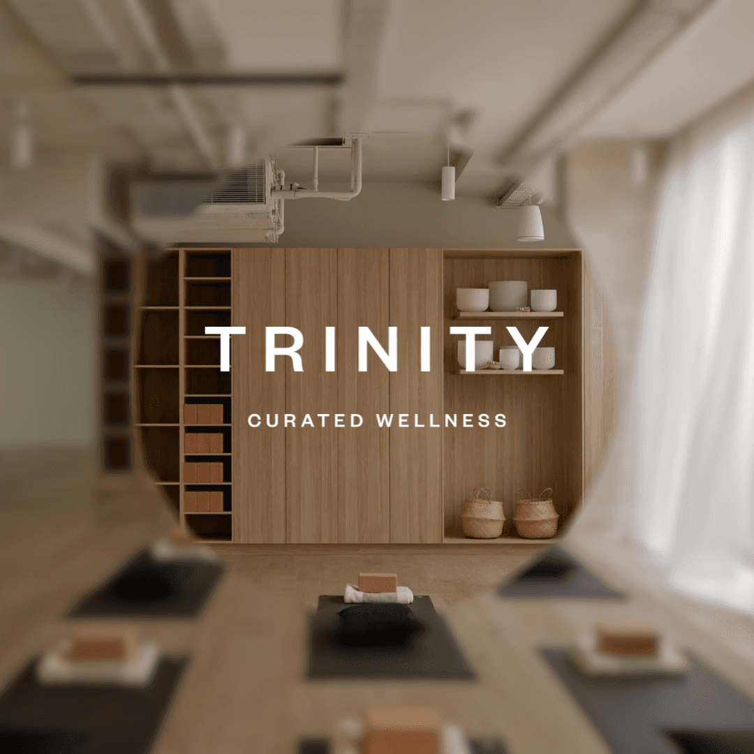 A man submerged in a bath, with only his head visible, eyes closed in deep relaxation.