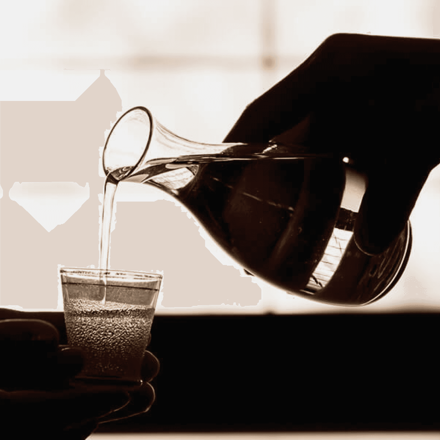 Someone pouring out sake