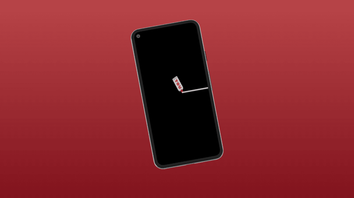 a cell phone leaning on a ledge