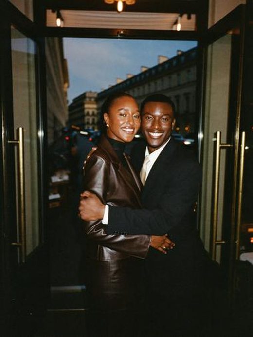 A couple in a restaurant doorway