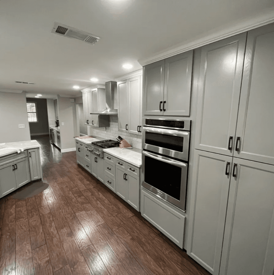 Professional cabinet painting and refinishing project with smooth painted cabinet doors