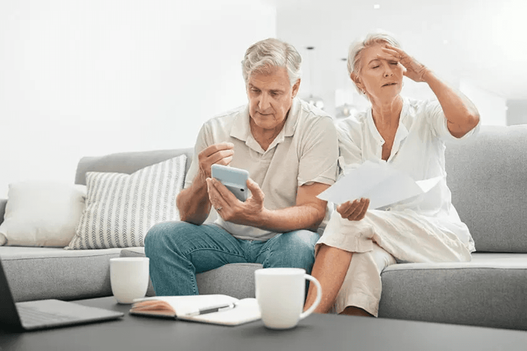 frustrated senior couple in debt 