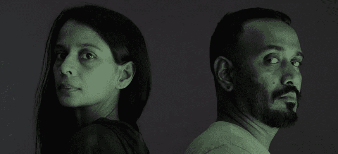 a group of women standing on top of a sandy beach