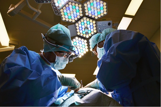 Doctors in a Kenyan operating room illustrating Bupa’s healthcare market entry supported by Woodrow Africa.