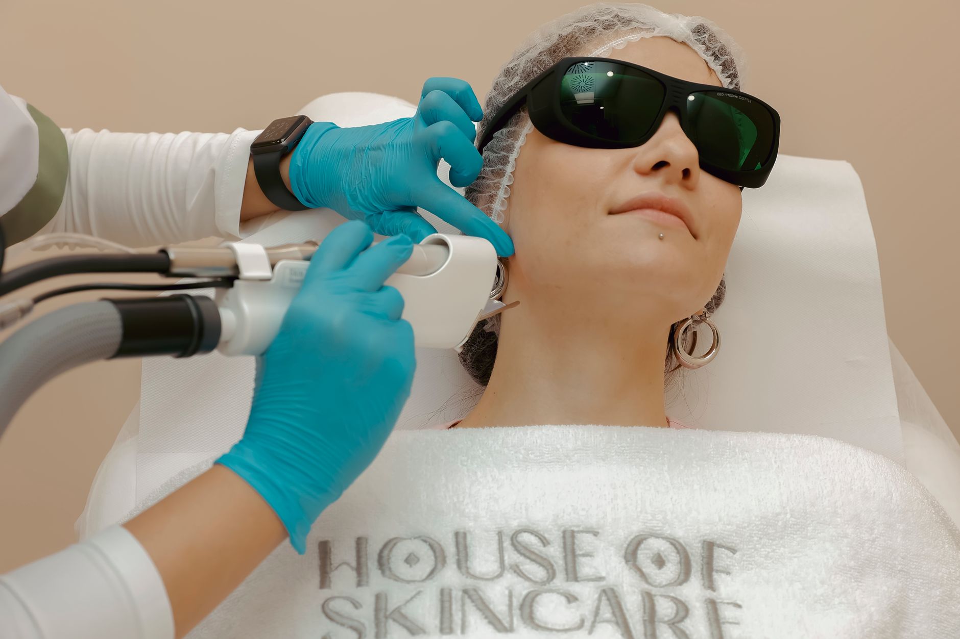 Woman examining skin concerns in mirror
