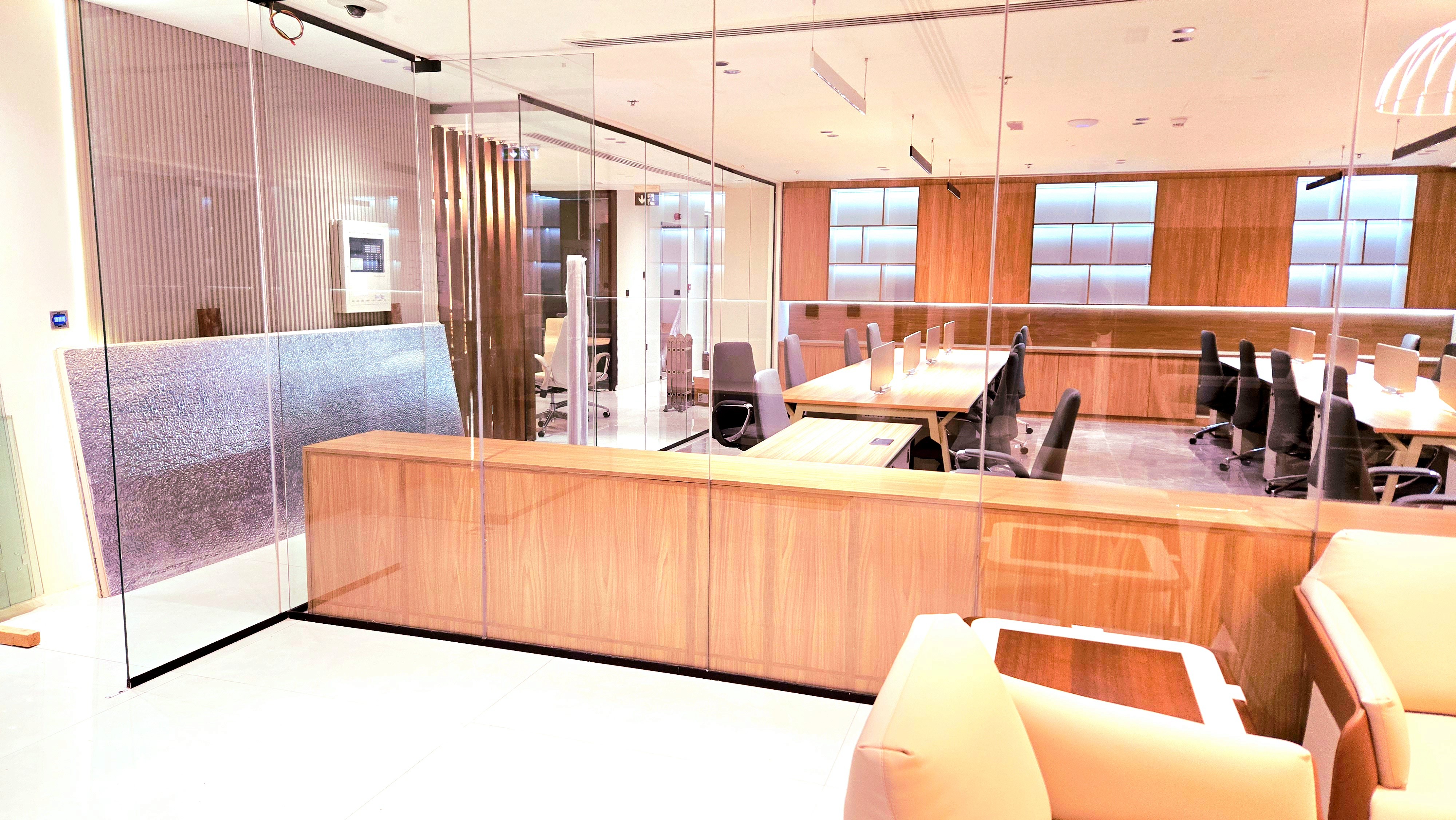 woman holding a phone and man looking at the phone. both are smiling