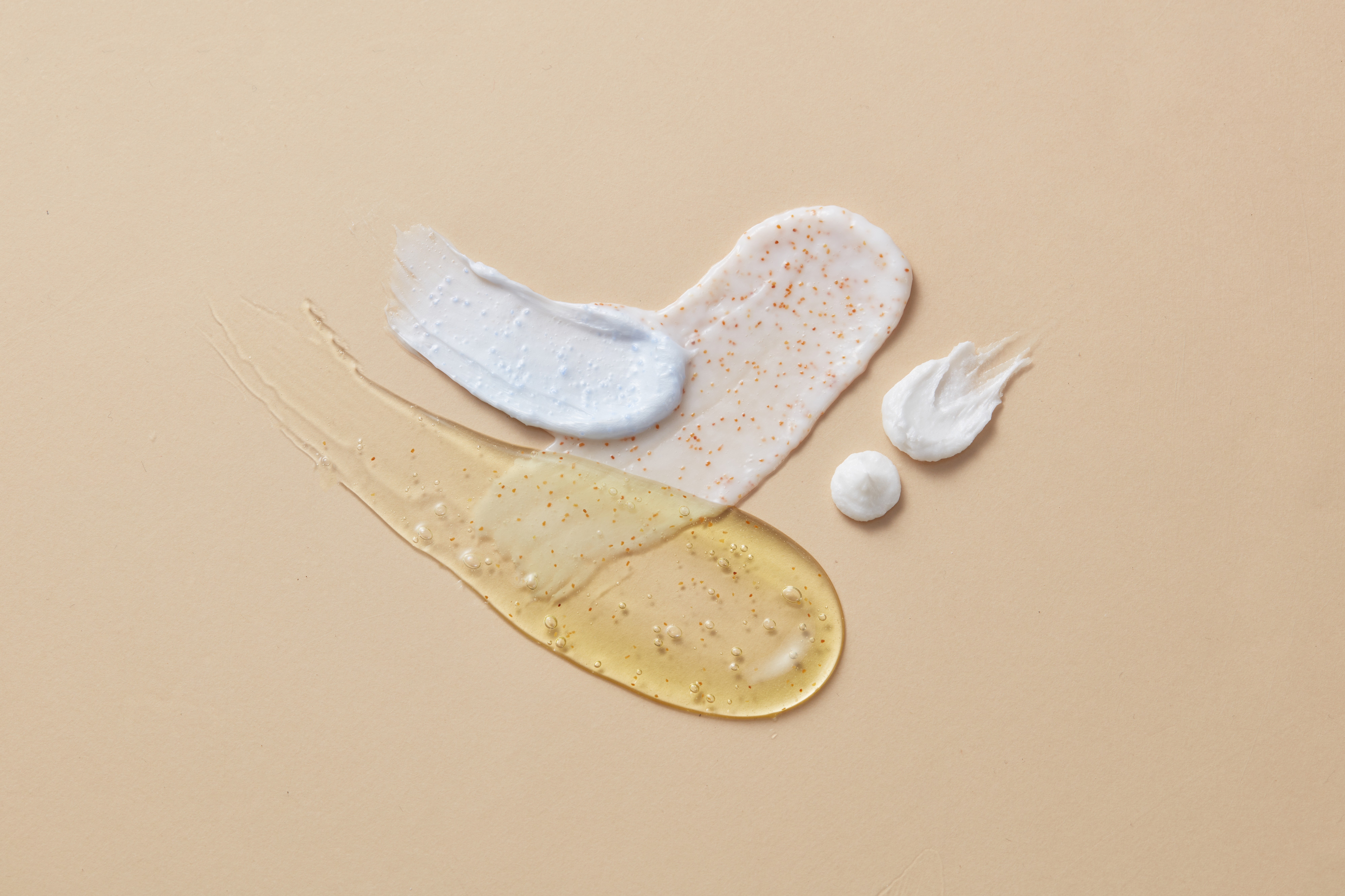 Skincare serum and cream texture swatches