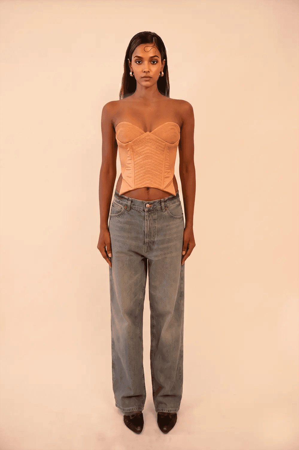 VANA is our one-of-a-kind silk corset, handcrafted in-house using a vintage silk saree. The structured silhouette features intricate hand-done cording details, allowing for a cinched yet refined wear that beautifully adds depth and dimension to the body. Vana is a quiet reflection of meticulous craftsmanship and intentional design.
