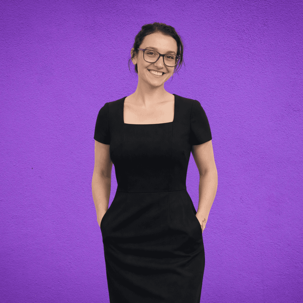 an image of a lady smiling in a black dress