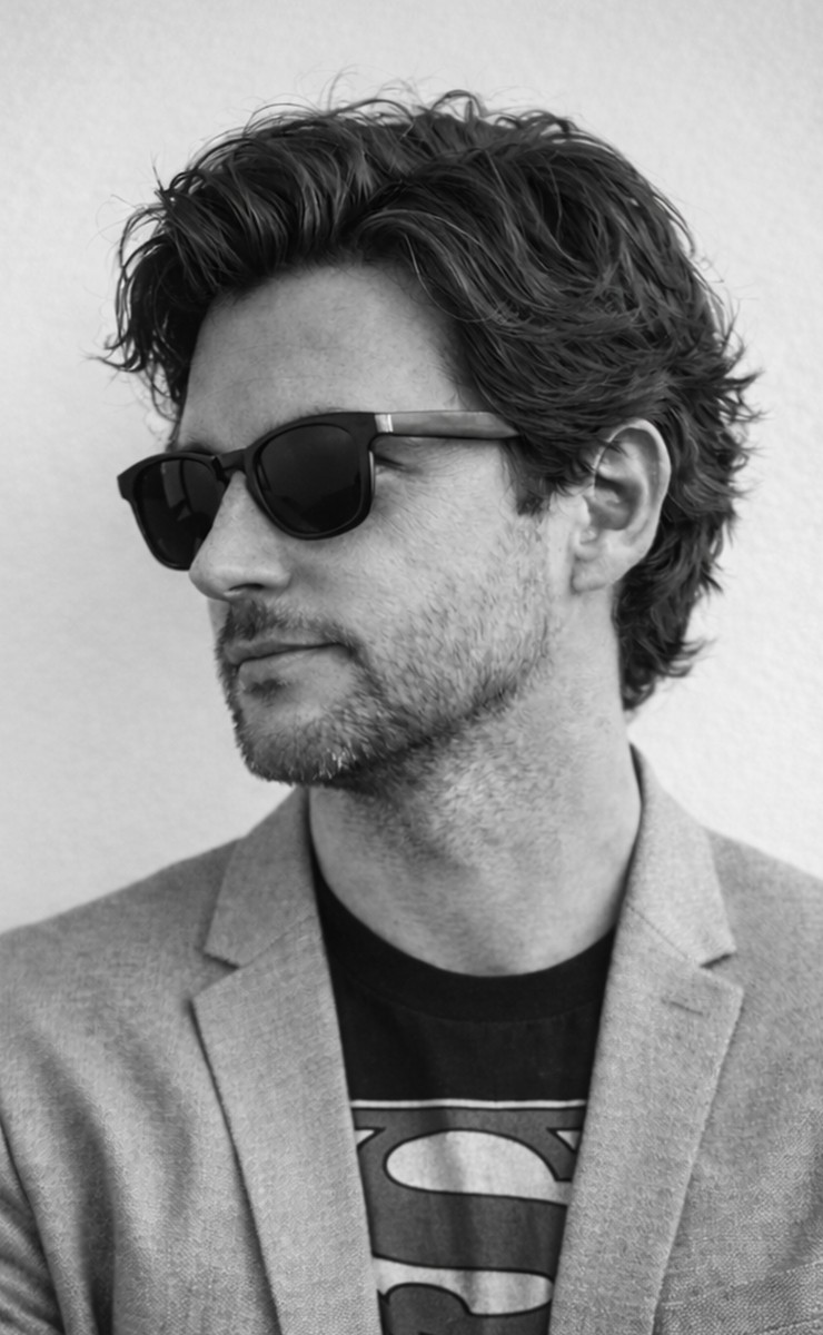 Person wearing white full-face hood with only eyes visible.