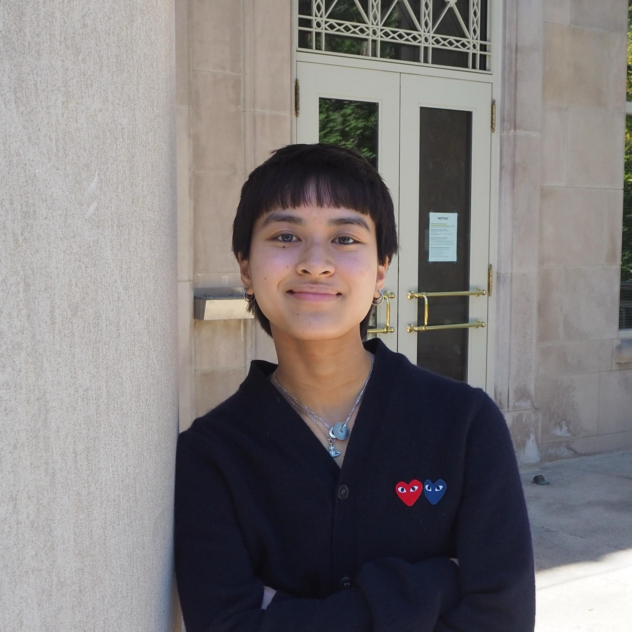 Blue-toned illustration of a bearded man with glasses against a black background