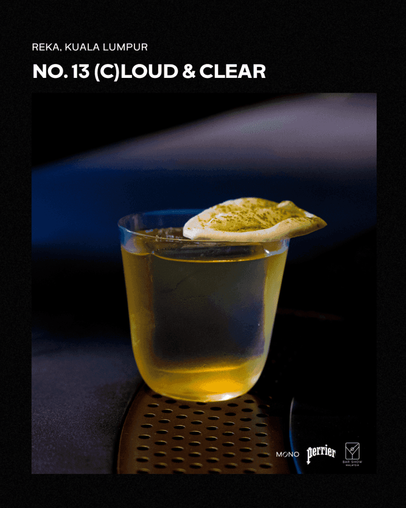 A close-up image of a cocktail named '(C)LOUD & CLEAR' from REKA in Kuala Lumpur, presented in a clear glass with a decorative garnish.