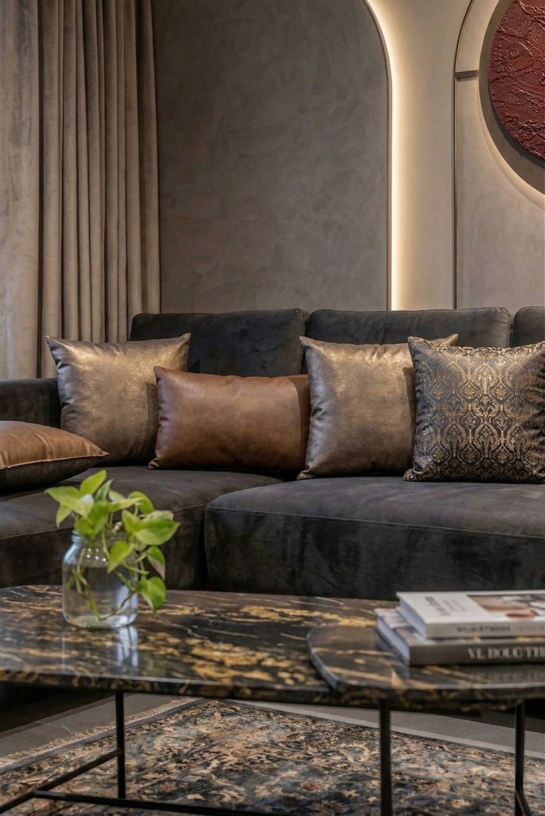 Vintage-modern living room with tufted sofas, false ceiling, and layered warm lighting.