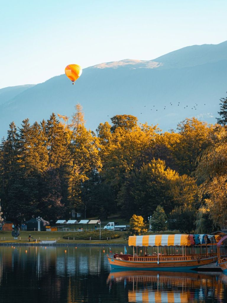 hot air balloon over lake bled