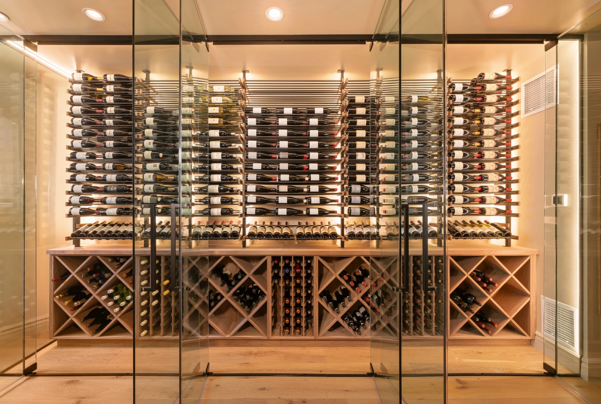 nfinity pool blending into the ocean view, minimalist sun loungers in soft neutral fabric, curved architecture