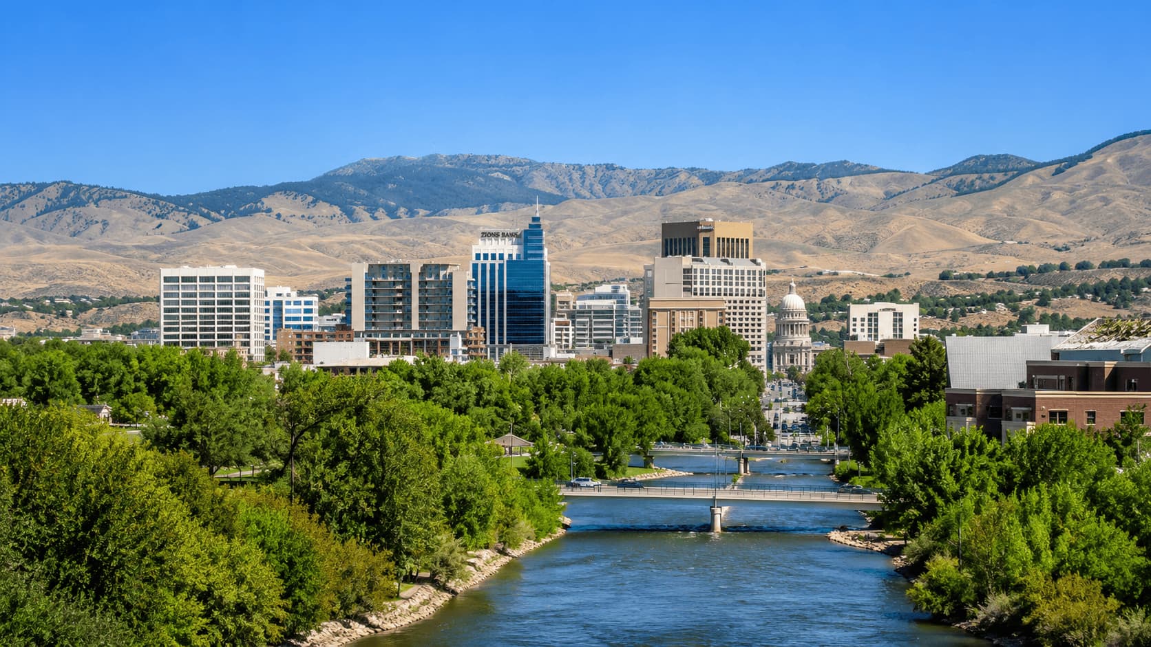 Boise skyline with river and trees under a clear sky in Idaho