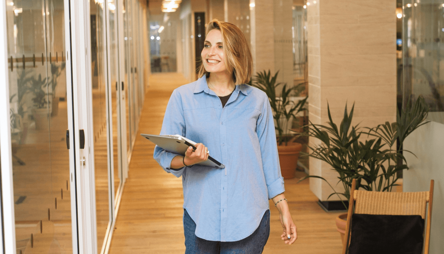 person sitting on grass and using phone