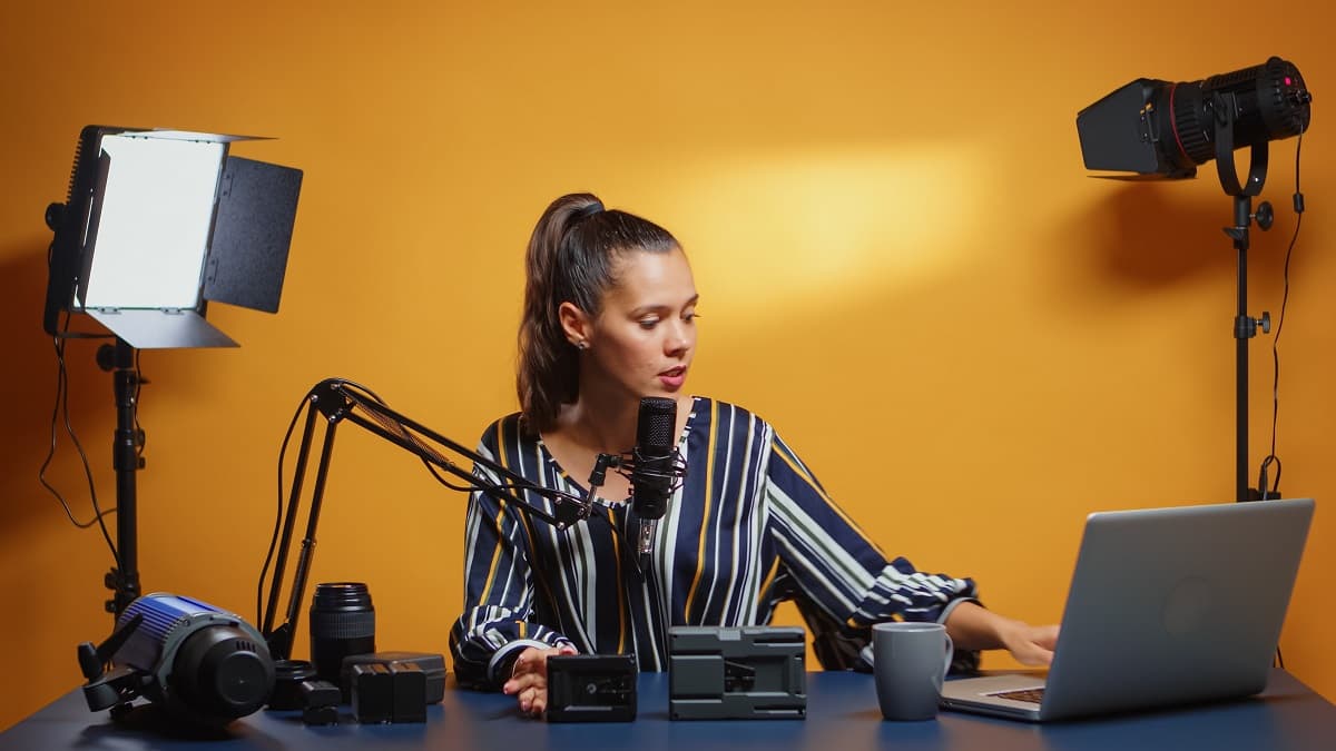 E-commerce seller managing content production setup while optimizing TikTok Shop backend settings for business growth.