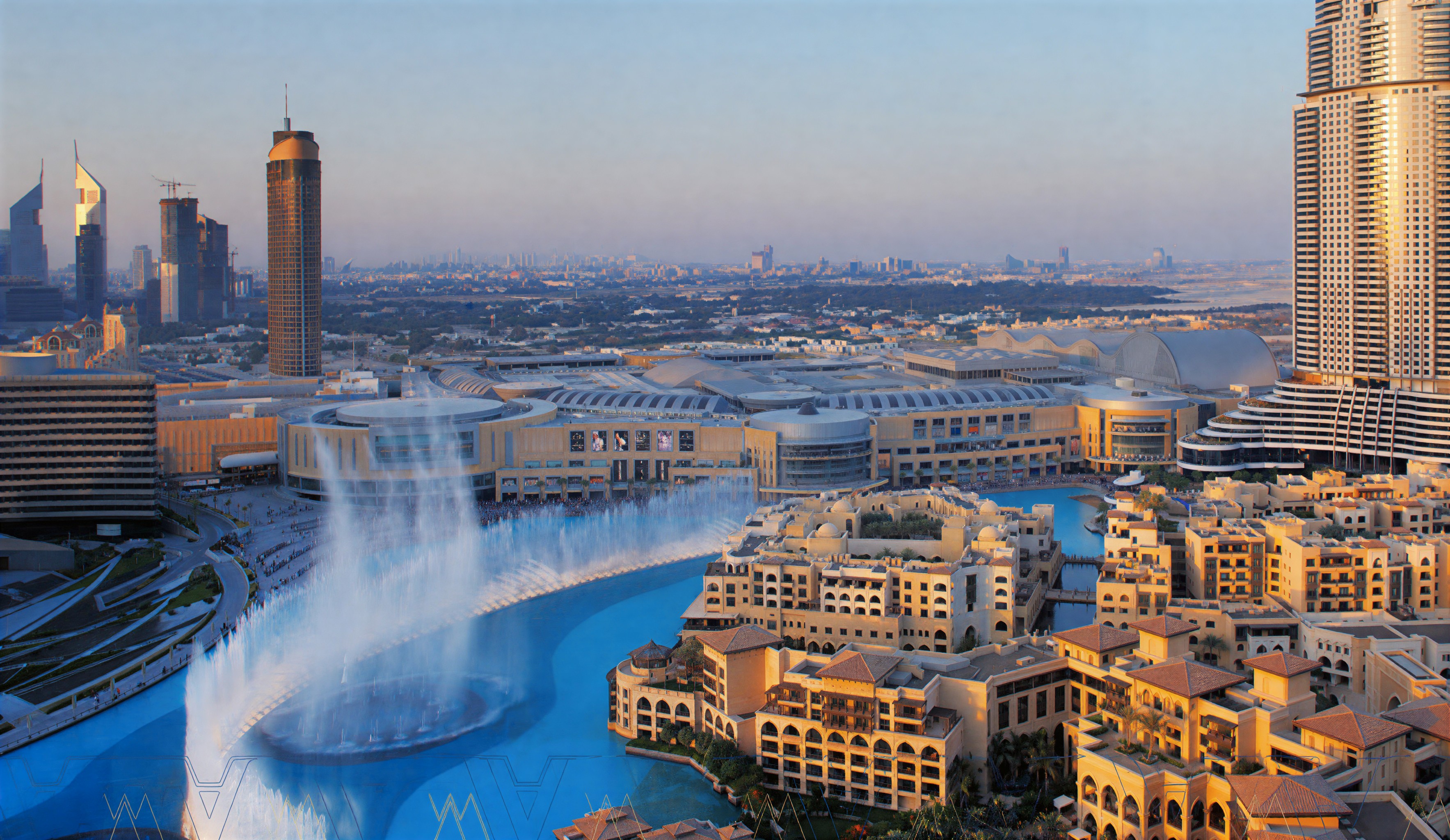 A panoramic view of Dubai's skyline, featuring Al Rashidiya, showcasing modern architecture and vibrant city life.